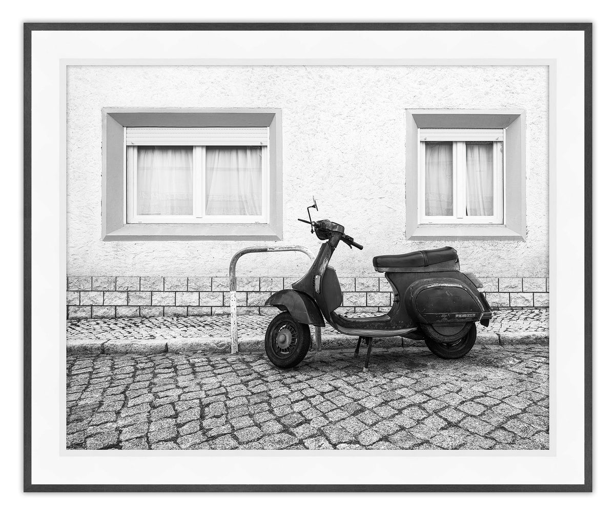 A Moped Along the Cobblestones