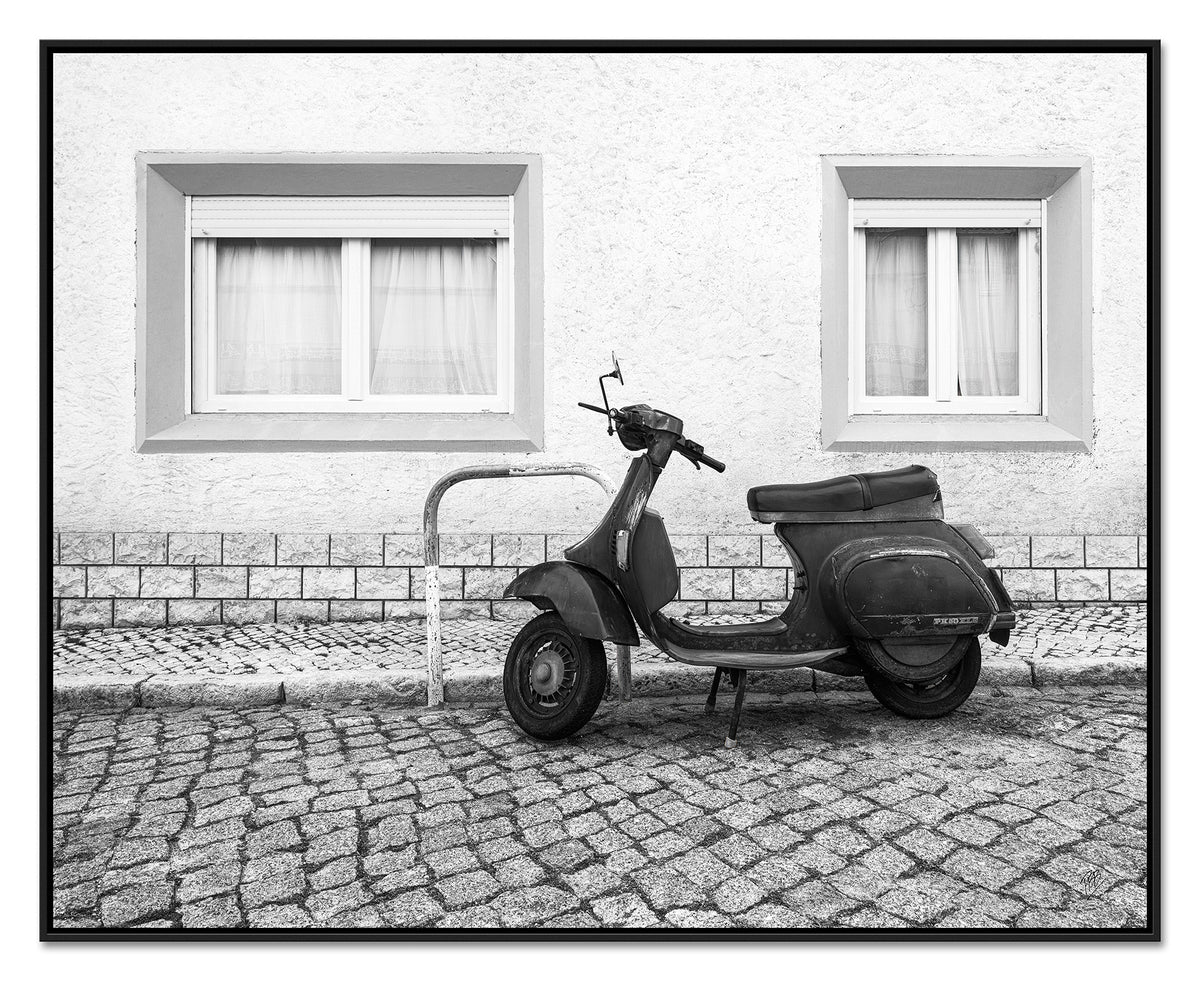 A Moped Along the Cobblestones