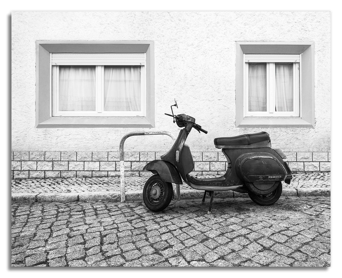 A Moped Along the Cobblestones