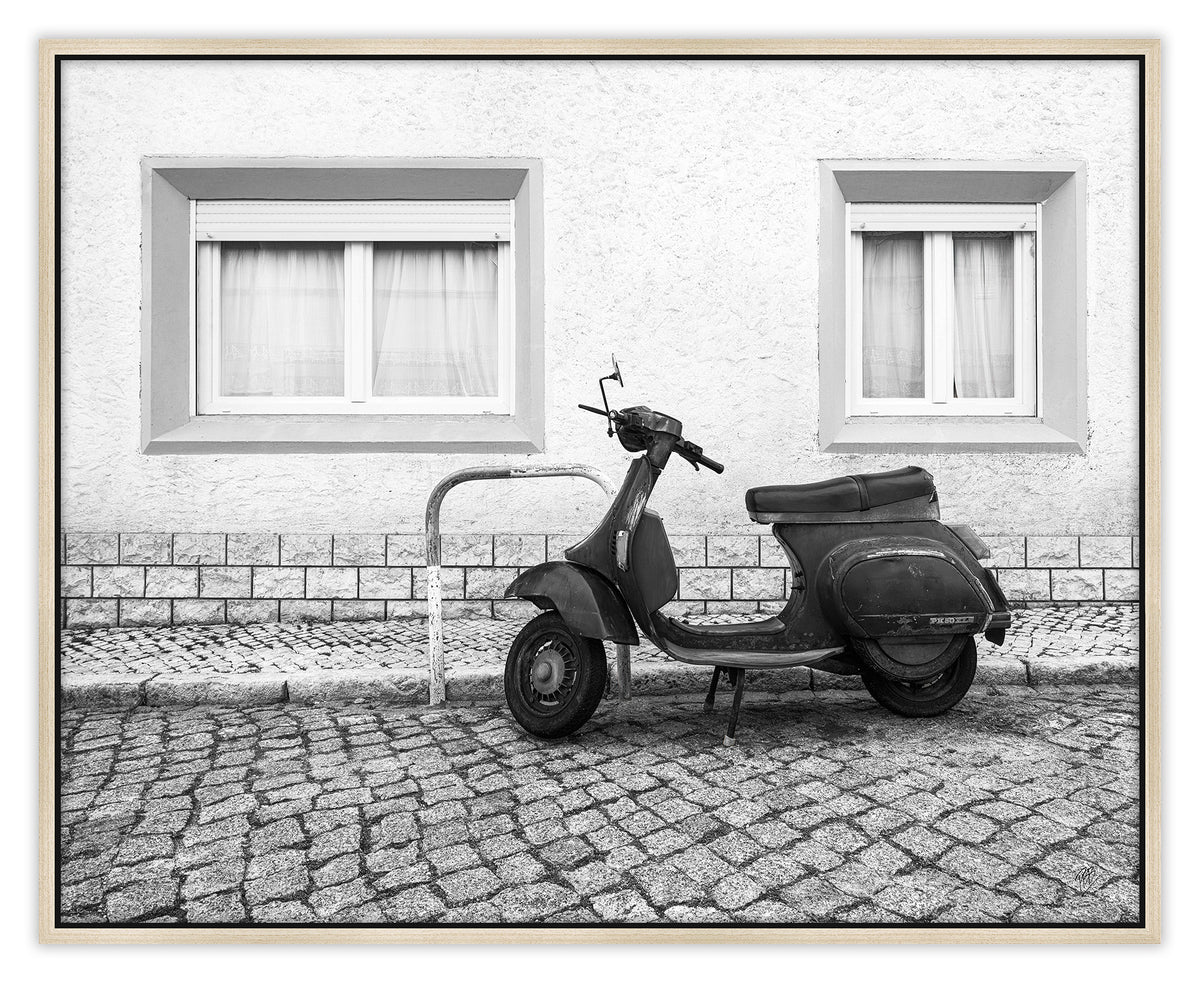 A Moped Along the Cobblestones