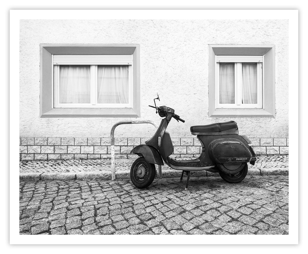 A Moped Along the Cobblestones