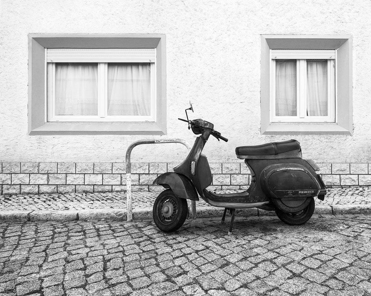 A Moped Along the Cobblestones